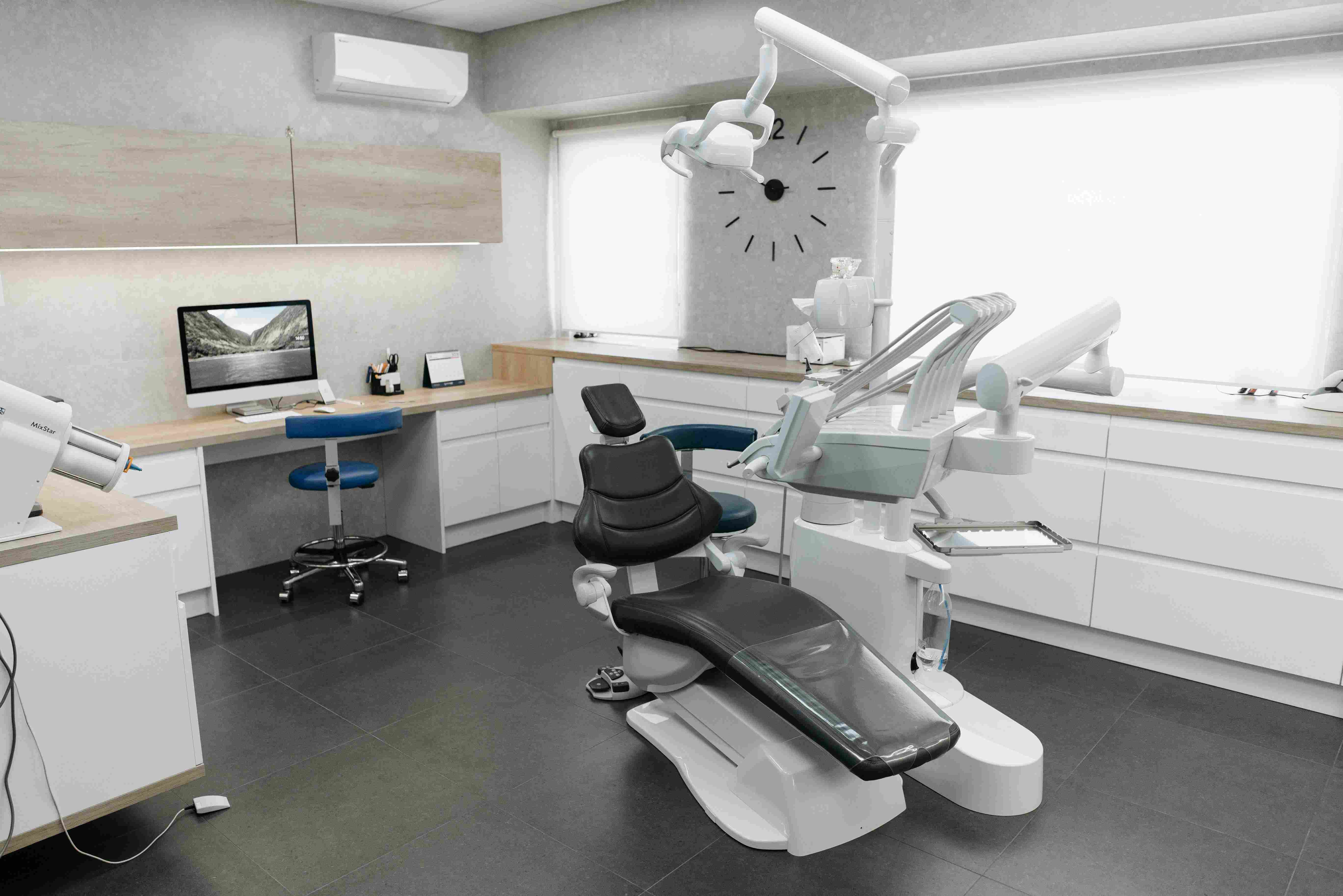 A dental patient smiling during a checkup at HLPID Dental